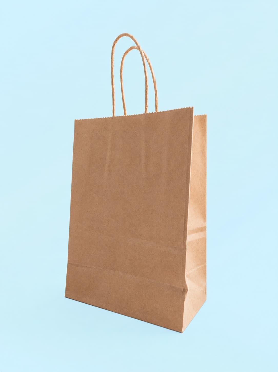 Bolsa kraft con asas impresa con logo de cliente — muestra real
